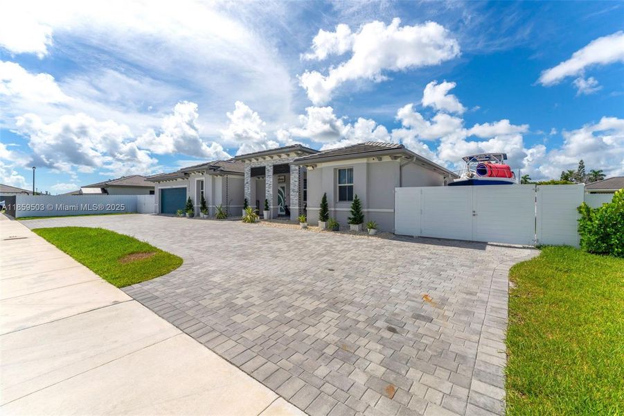 Front exterior of a new home in , Homestead, FL, highlighting curb appeal (Image 2). Front exterior of a new home in , Homestead, FL, highlighting curb appeal (Image 2).