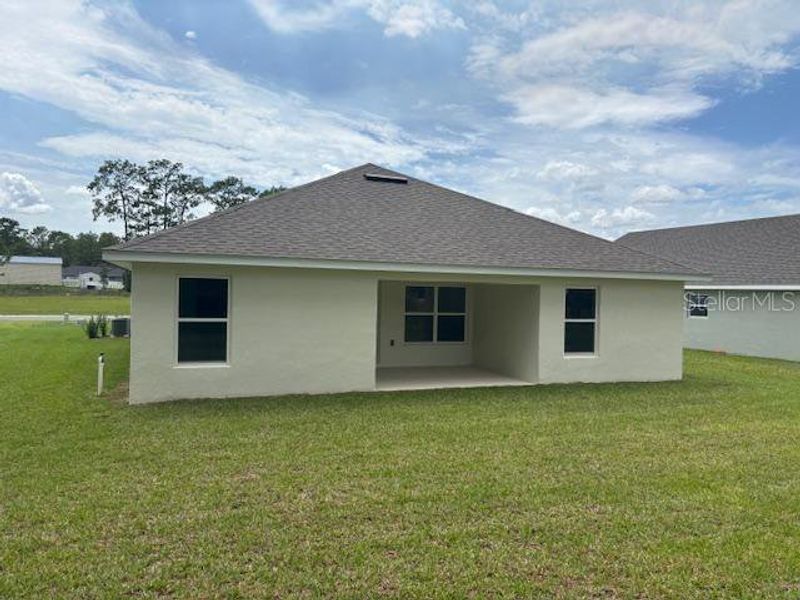 Front exterior of a new home in Juliette Falls, Dunnellon, FL, highlighting curb appeal (Image 11).