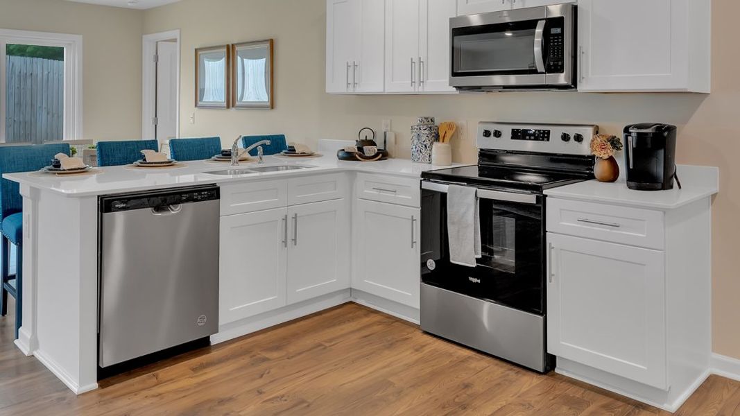 Representative furnished interior of a home built from the Macon by D.R. Horton in The Hideaway at Fox Meadows, Bluff City (Image 7).