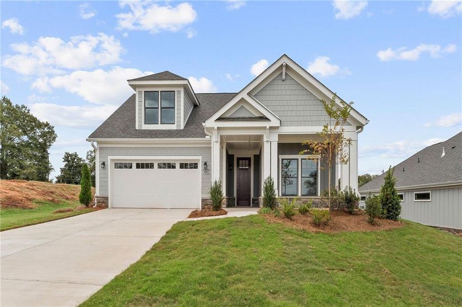Front exterior of a new home in The Courtyards at Post Road, Cumming, GA, highlighting curb appeal (Image 1).