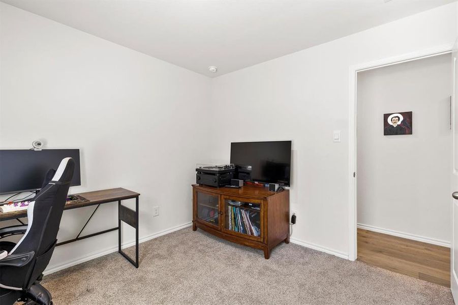 Office with light colored carpet and baseboards Office with light colored carpet and baseboards