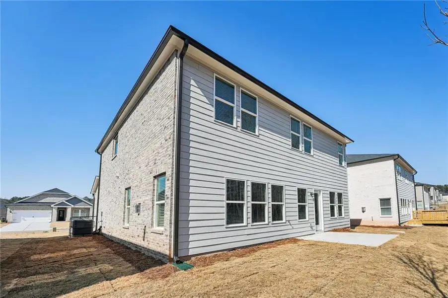 Exterior details and patio area of a home in Creekside at Oxford Park, Fairburn (Image 4).