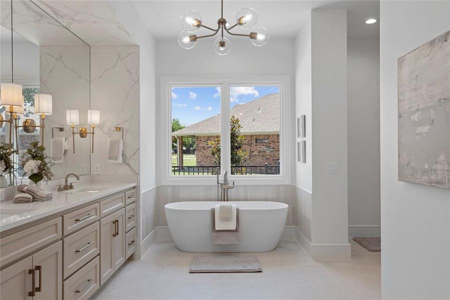 Primary bathroom with high end fixtures and stone selections.