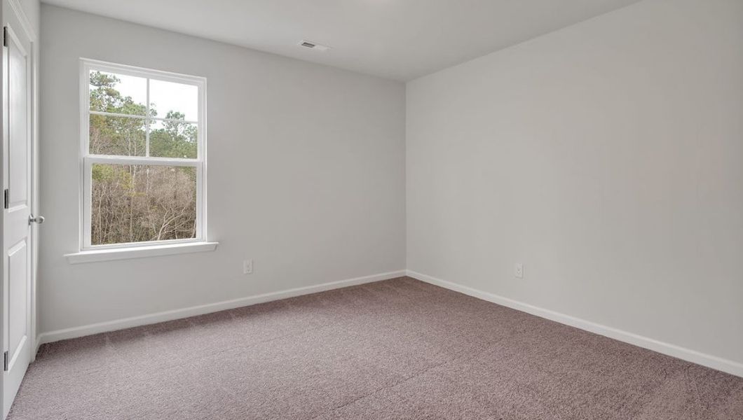 Representative unfurnished interior of a home built from the GLYNN by D.R. Horton in Grayson Park, Leland (Image 29).