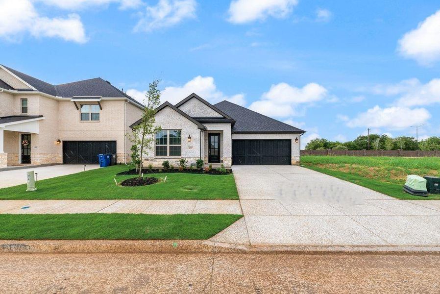Front exterior of a new home in Sutton Fields, Celina, TX, highlighting curb appeal (Image 16). Front exterior of a new home in Sutton Fields, Celina, TX, highlighting curb appeal (Image 16).
