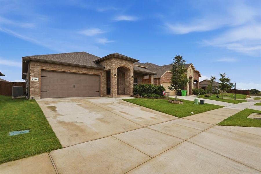 Front exterior of a new home in , Haslet, TX, highlighting curb appeal (Image 23).