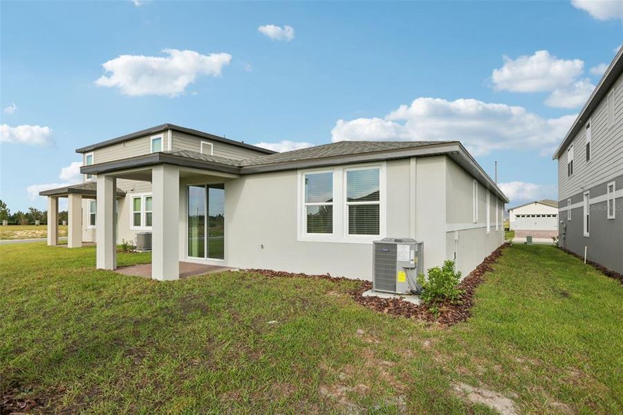 Exterior details and patio area of a home in Springs at Lake Alfred - Classic Series, Lake Alfred (Image 26).