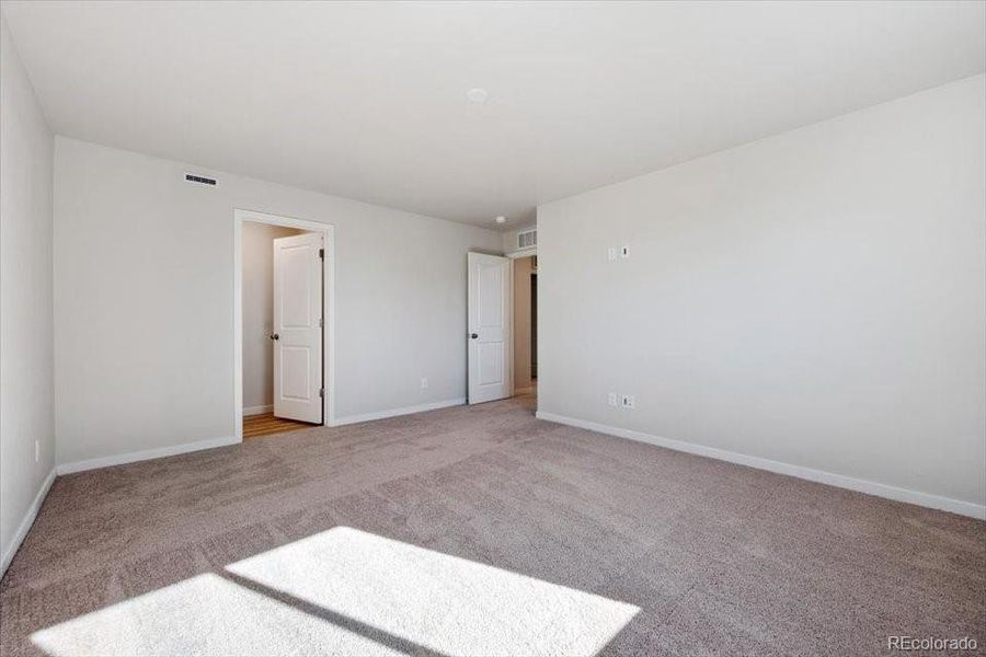 Spacious, unfurnished interior of a new home in The Boulevard II Collection at Windler, Aurora (Image 22).