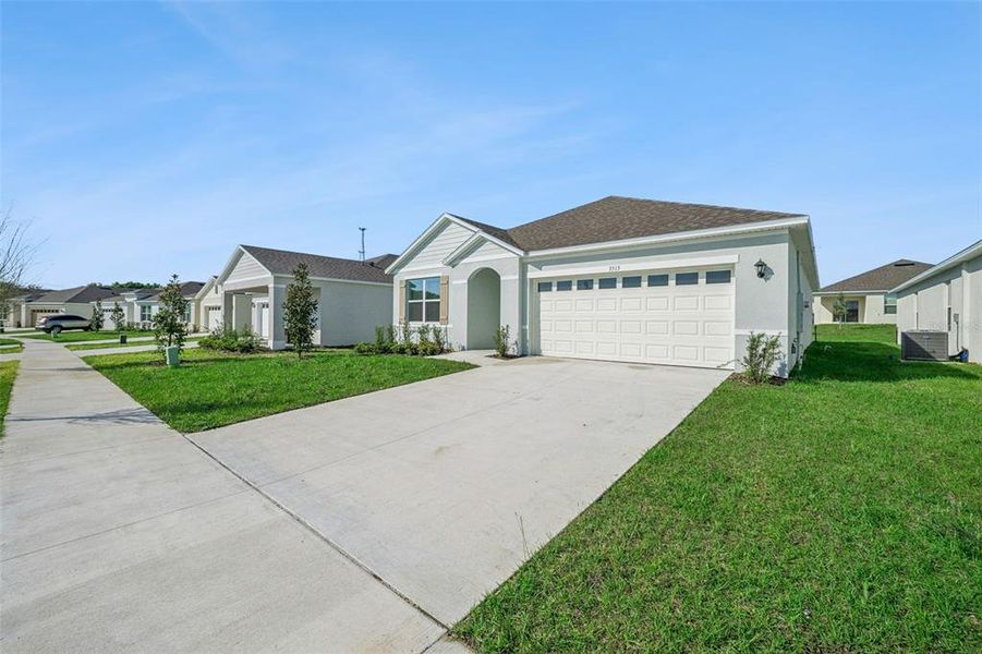 Front exterior of a new home in , Tavares, FL, highlighting curb appeal (Image 17).