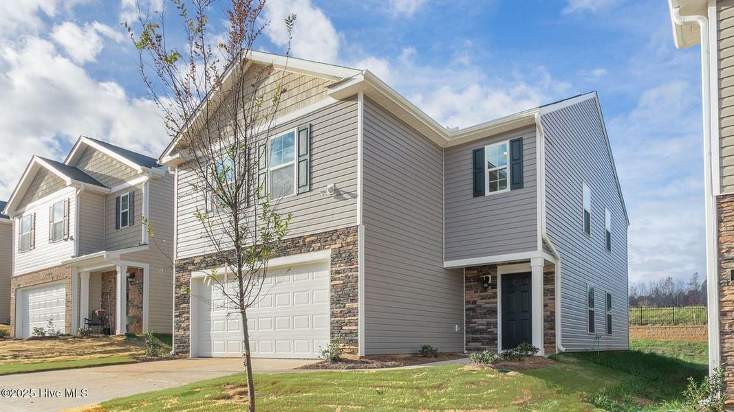 Front exterior of a new home in Hunter Hill, Rocky Mount, NC, highlighting curb appeal (Image 2). Front exterior of a new home in Hunter Hill, Rocky Mount, NC, highlighting curb appeal (Image 2).