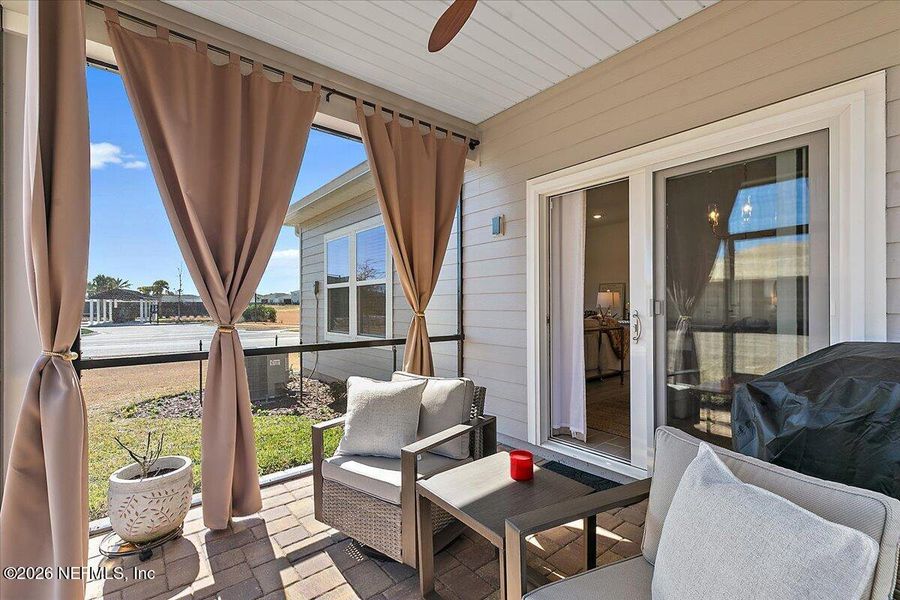 Exterior details and patio area of a home in Edenbrooke at Hyland Trail | 55+, Green Cove Springs (Image 3).