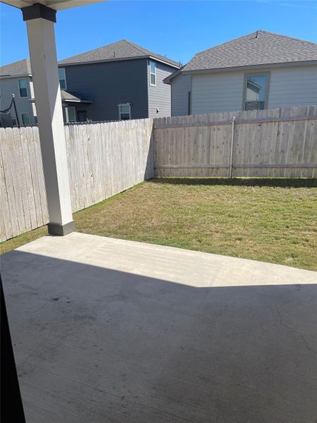 Fenced backyard with a patio Fenced backyard with a patio