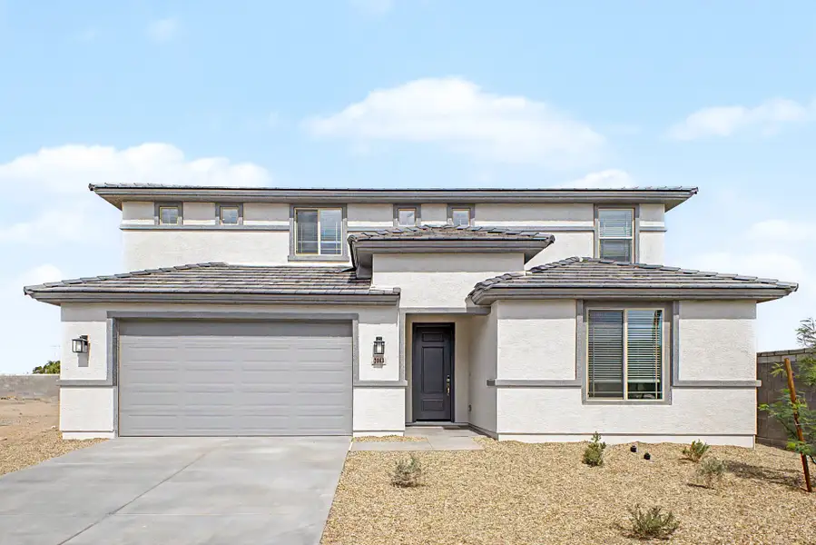 Front exterior of a new home in Bentridge, Buckeye, AZ, highlighting curb appeal (Image 1). Front exterior of a new home in Bentridge, Buckeye, AZ, highlighting curb appeal (Image 1).