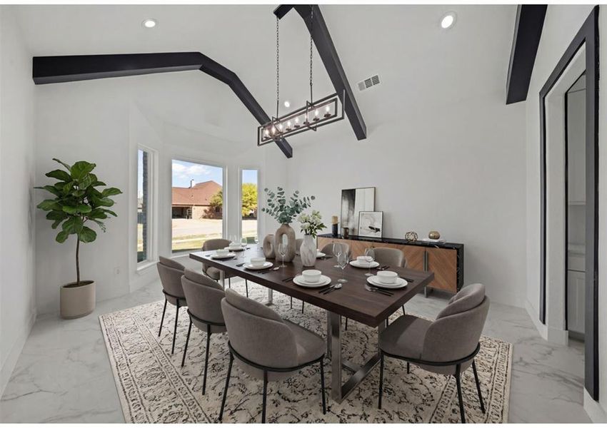 Virtually Staged - Dining space with vaulted ceiling and light marble finish floors