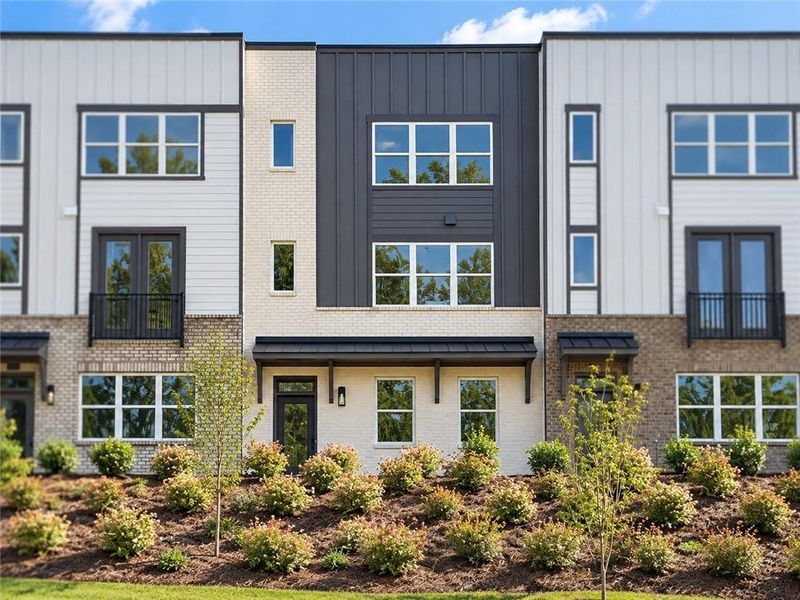 Front exterior of a new home in Overlook at Peachtree Corners, Peachtree Corners, GA, highlighting curb appeal (Image 1). Front exterior of a new home in Overlook at Peachtree Corners, Peachtree Corners, GA, highlighting curb appeal (Image 1).