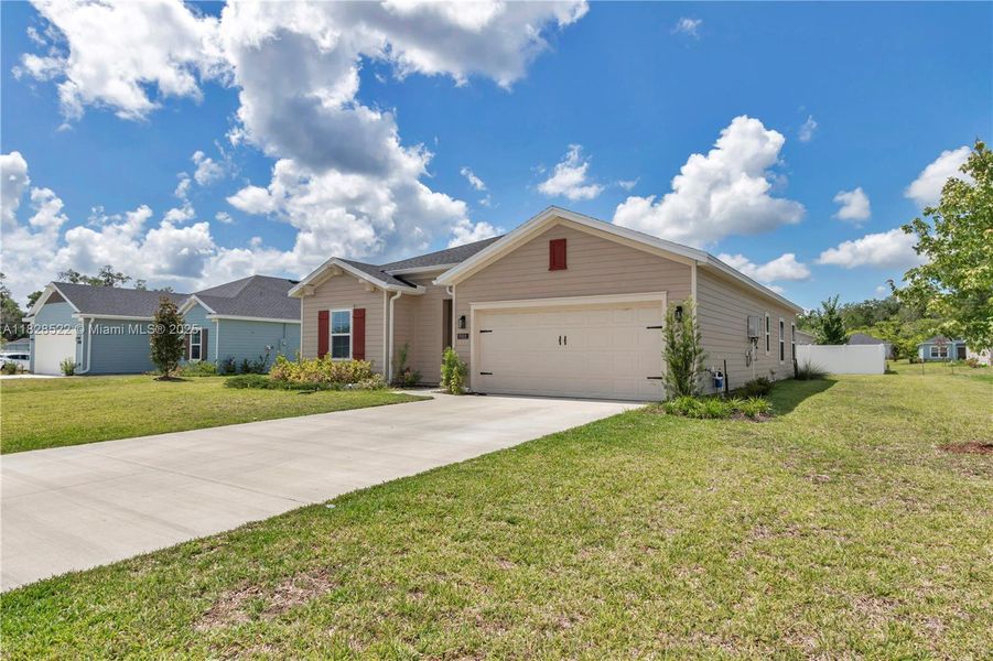 Front exterior of a new home in Country Lane Estates, Williston, FL, highlighting curb appeal (Image 22). Front exterior of a new home in Country Lane Estates, Williston, FL, highlighting curb appeal (Image 22).