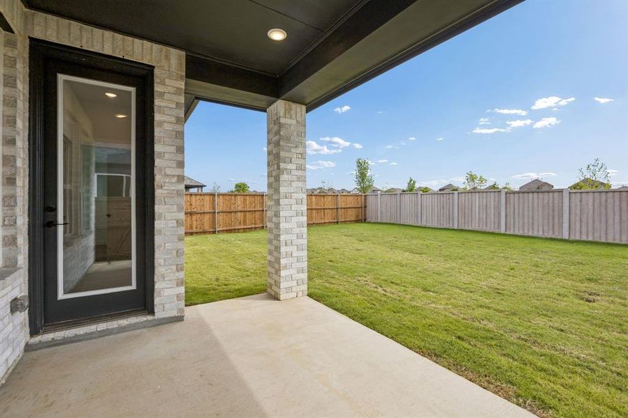 Exterior details and patio area of a home in , Aubrey (Image 3).
