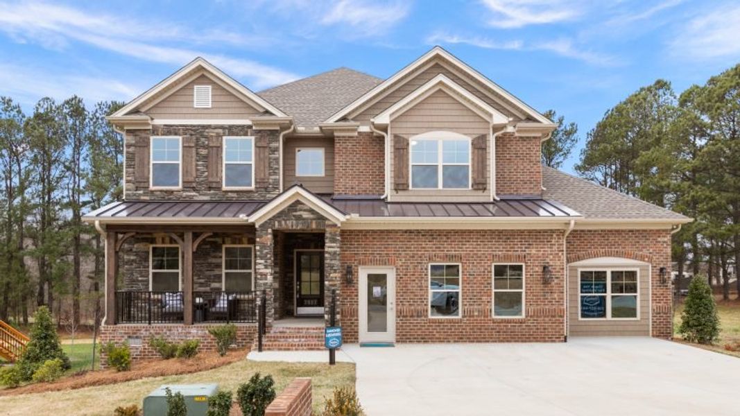 Front exterior of a new home in Preserve at Carriage Cove, Oak Ridge, NC, highlighting curb appeal (Image 26).