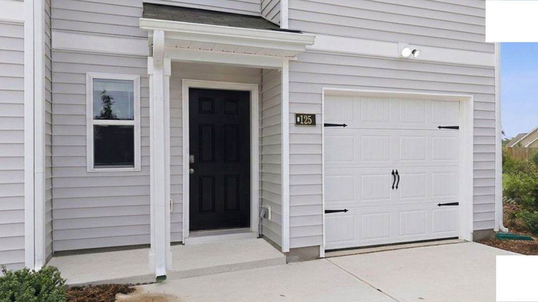 Exterior details and patio area of a home in The Townes at Hunter Hill, Rocky Mount (Image 3).