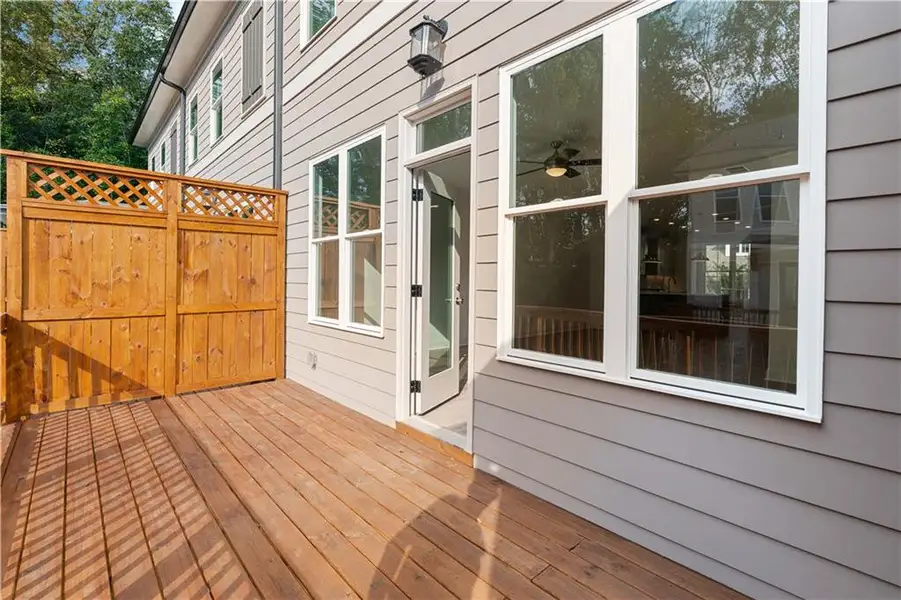 Exterior details and patio area of a home in Evanshire Townhomes, Duluth (Image 26). Exterior details and patio area of a home in Evanshire Townhomes, Duluth (Image 26).