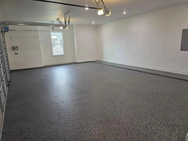 Garage with electric panel and a garage door opener Garage with electric panel and a garage door opener