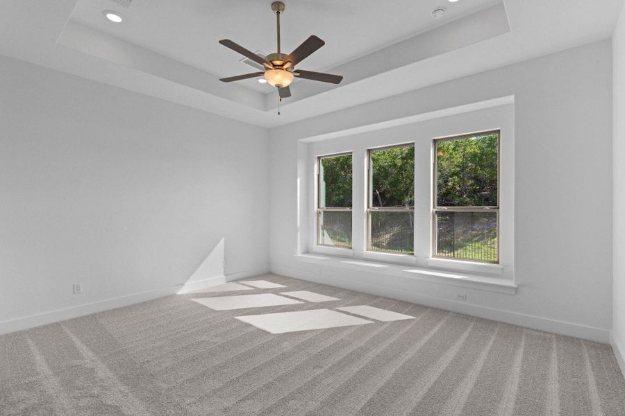 Primary Bedroom with elevated ceiling