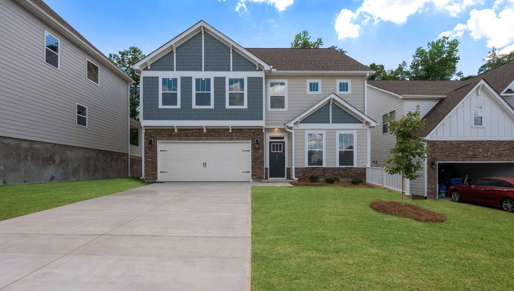 Front exterior of a new home in Cottonwood Ridge, Piedmont, SC, highlighting curb appeal (Image 1). Front exterior of a new home in Cottonwood Ridge, Piedmont, SC, highlighting curb appeal (Image 1).