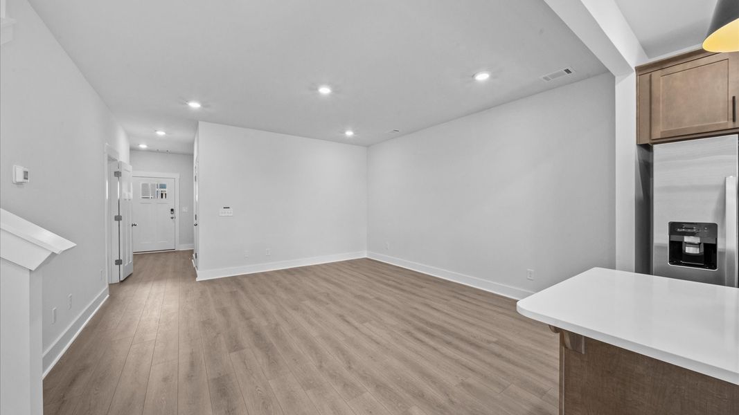 Hardwood flooring open concept family room in two story townhome at Ransdell Pointe by DRB Homes in Spartanburg, SC