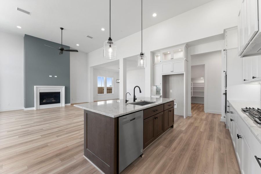 Move seamlessly through the Kitchen, Great Room and Dining Room