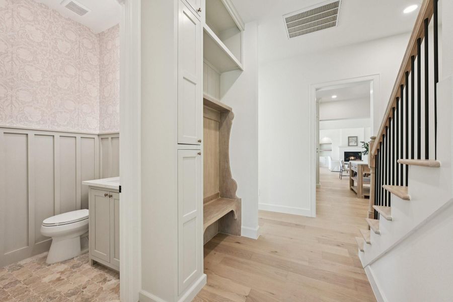 Drop zone and powder room near laundry room and garage entry (garage is on other side of staircase) Drop zone and powder room near laundry room and garage entry (garage is on other side of staircase)