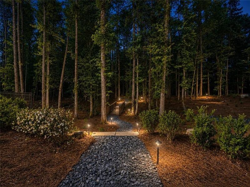Softly lit path to get to Byers Park hidden gathering space Softly lit path to get to Byers Park hidden gathering space