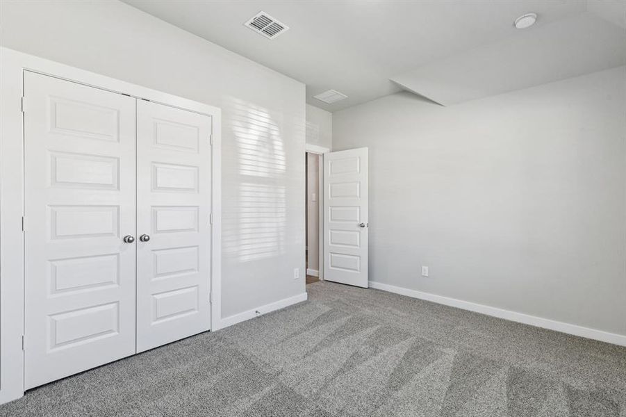 Bedroom in the Heisman home plan by Trophy Signature Homes – REPRESENTATIVE PHOTO Bedroom in the Heisman home plan by Trophy Signature Homes – REPRESENTATIVE PHOTO