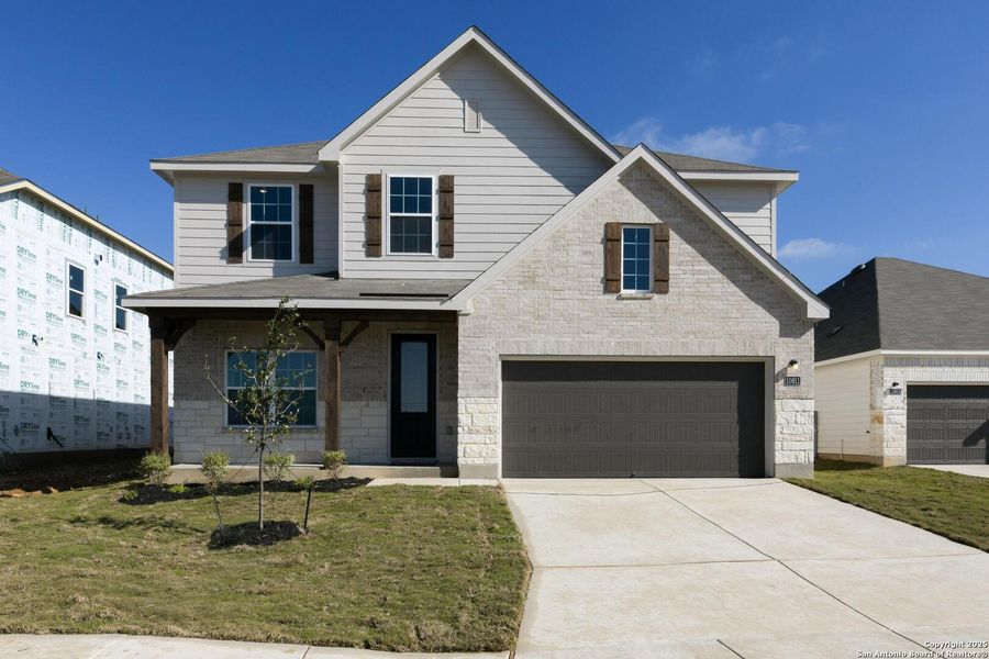 Front exterior of a new home in The Preserve at the Wilder, Adkins, TX, highlighting curb appeal (Image 1). Front exterior of a new home in The Preserve at the Wilder, Adkins, TX, highlighting curb appeal (Image 1).