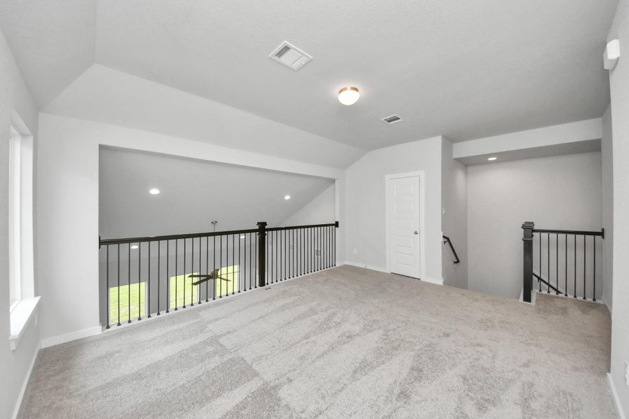 Ascend to relaxation in this fantastic game room! Ideal for both casual gatherings and adult gaming, it boasts plush carpet, lofty ceilings, custom paint, and ample windows for abundant natural light Ascend to relaxation in this fantastic game room! Ideal for both casual gatherings and adult gaming, it boasts plush carpet, lofty ceilings, custom paint, and ample windows for abundant natural light