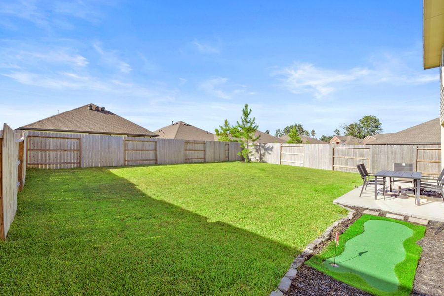 Front exterior of a new home in , Conroe, TX, highlighting curb appeal (Image 21).