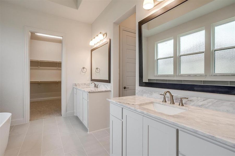 Bathroom with vanity and tile patterned floors