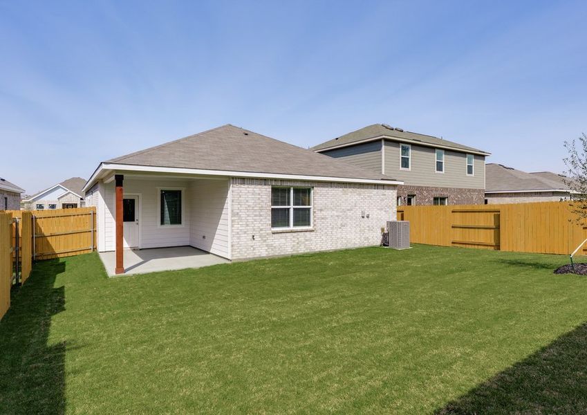 The back yard is fully fenced in.