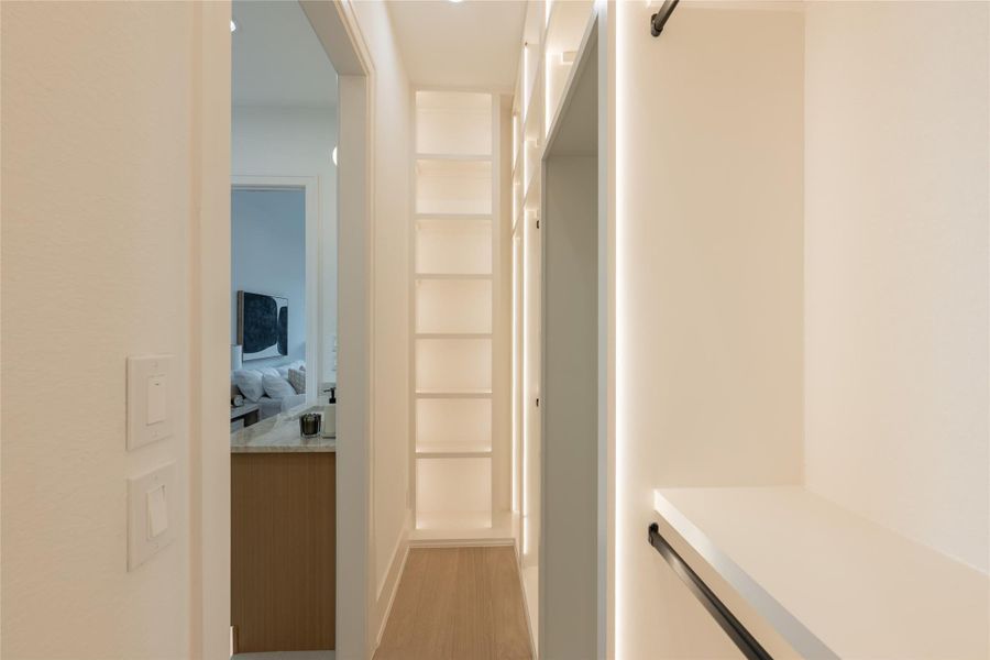 Defined by custom storage and thoughtful layout, the closet creates a functional extension of the primary suite with a refined, modern feel.