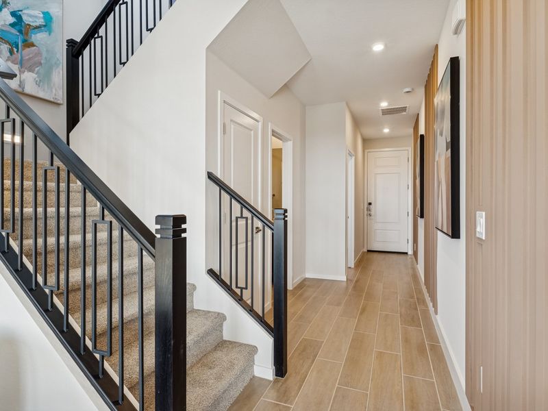 A long hallway with white doors. A long hallway with white doors.