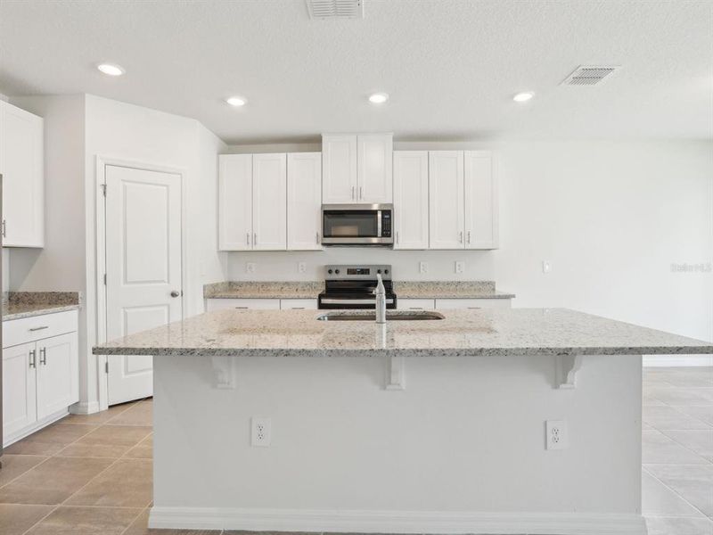Furnished interior view inside a new home in The Reserve at Van Oaks, Auburndale (Image 7).