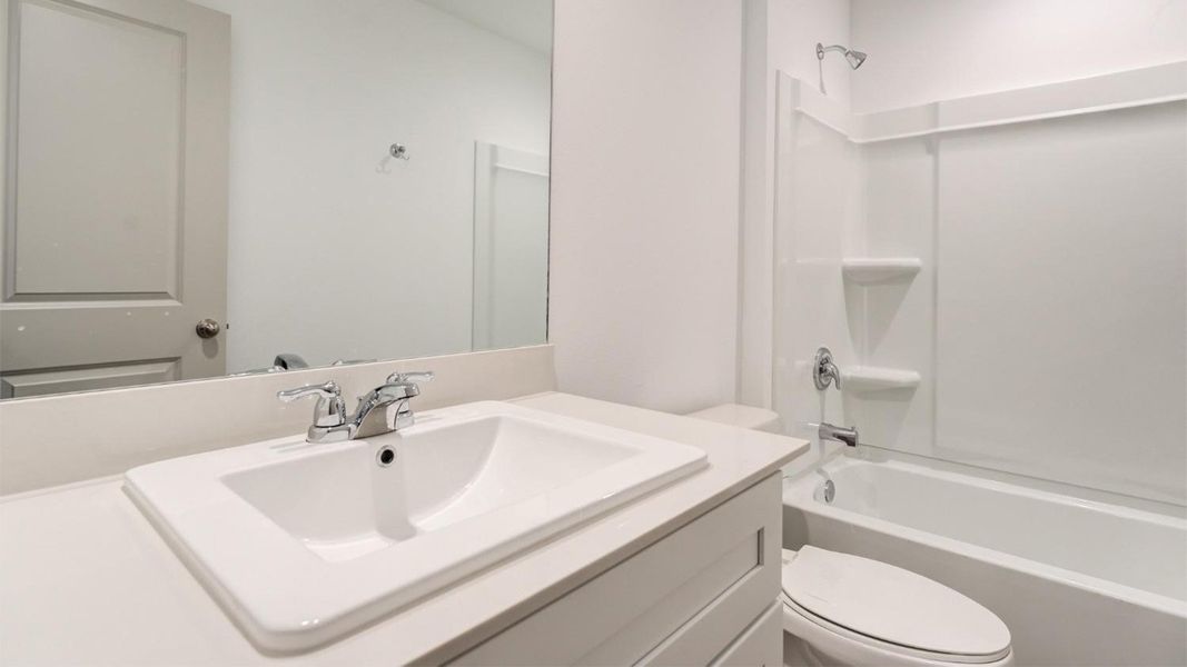Representative furnished interior of a home built from the The Ashburn by D.R. Horton in Allen Farms, Lubbock (Image 12).