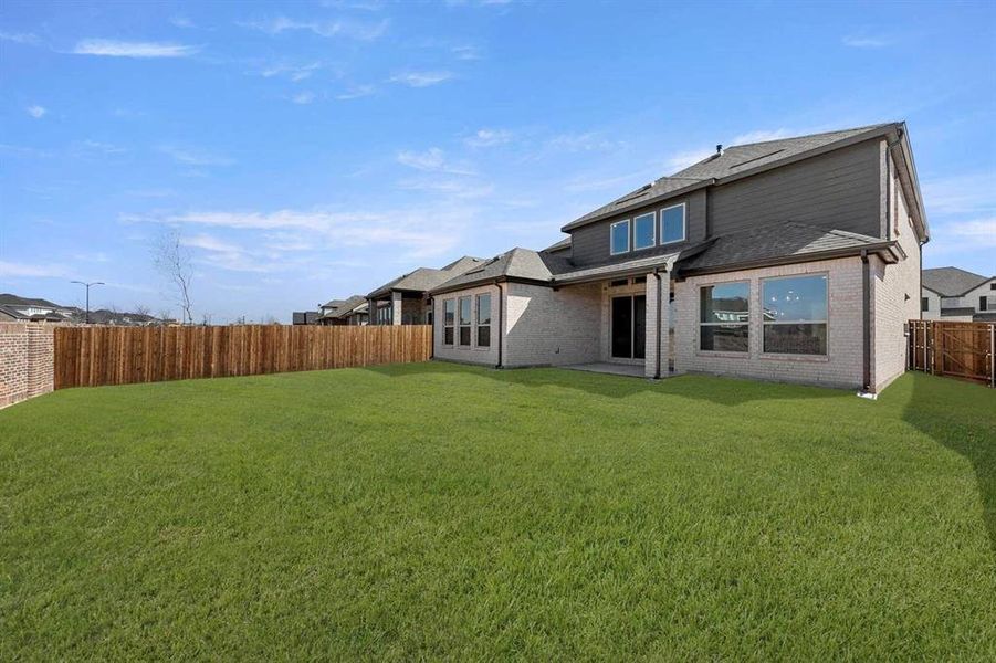 Exterior details and patio area of a home in Valencia on The Lake, Little Elm (Image 28). Exterior details and patio area of a home in Valencia on The Lake, Little Elm (Image 28).