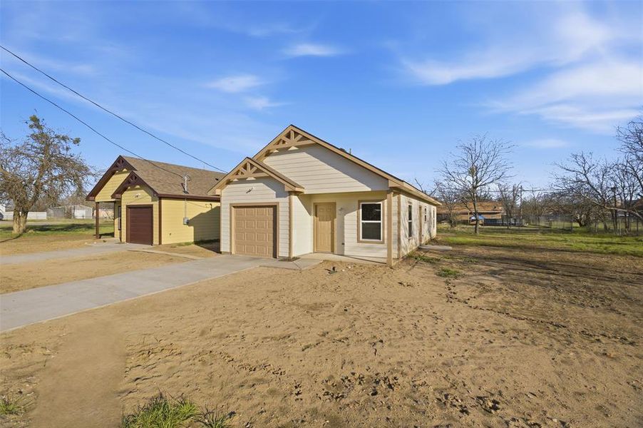 Front exterior of a new home in , Mineral Wells, TX, highlighting curb appeal (Image 15).
