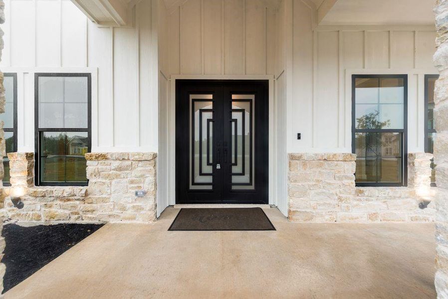 Entrance to property featuring french doors