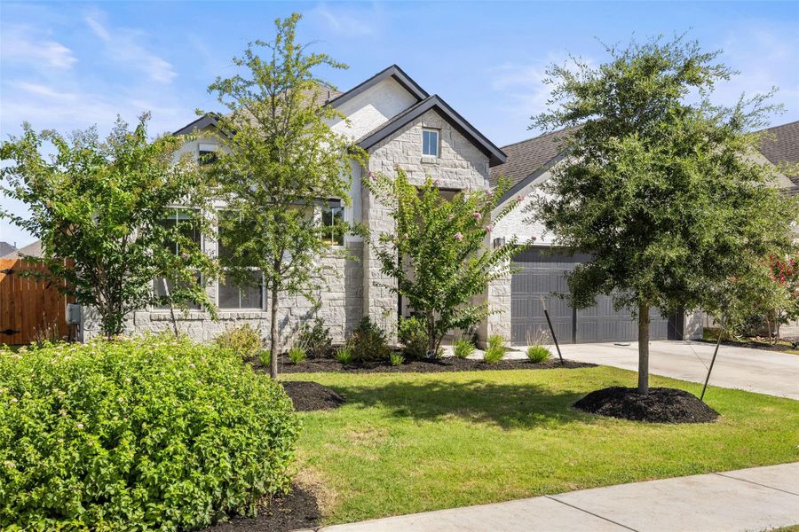 Front exterior of a new home in Sweetwater, Austin, TX, highlighting curb appeal (Image 27).