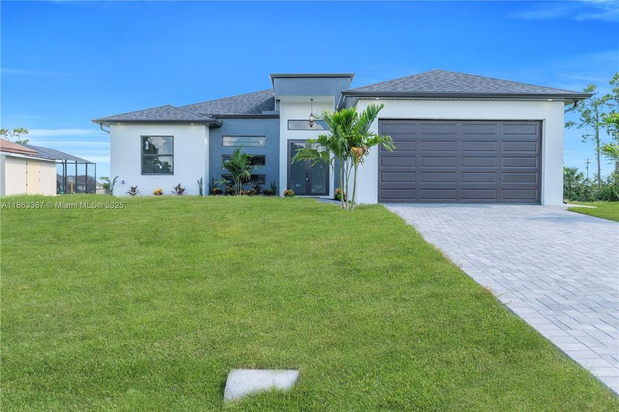 Front exterior of a new home in , Cape Coral, FL, highlighting curb appeal (Image 2).