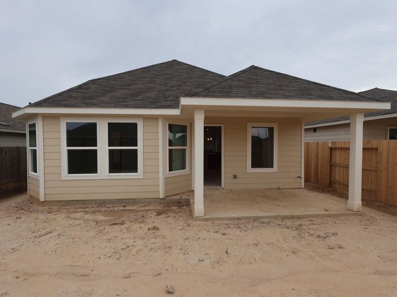 Exterior details and patio area of a home in Pinewood at Grand Texas, New Caney (Image 3). Exterior details and patio area of a home in Pinewood at Grand Texas, New Caney (Image 3).