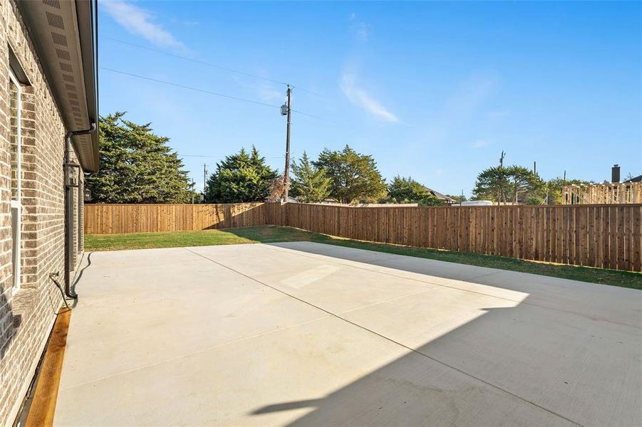 Fenced backyard featuring a patio area