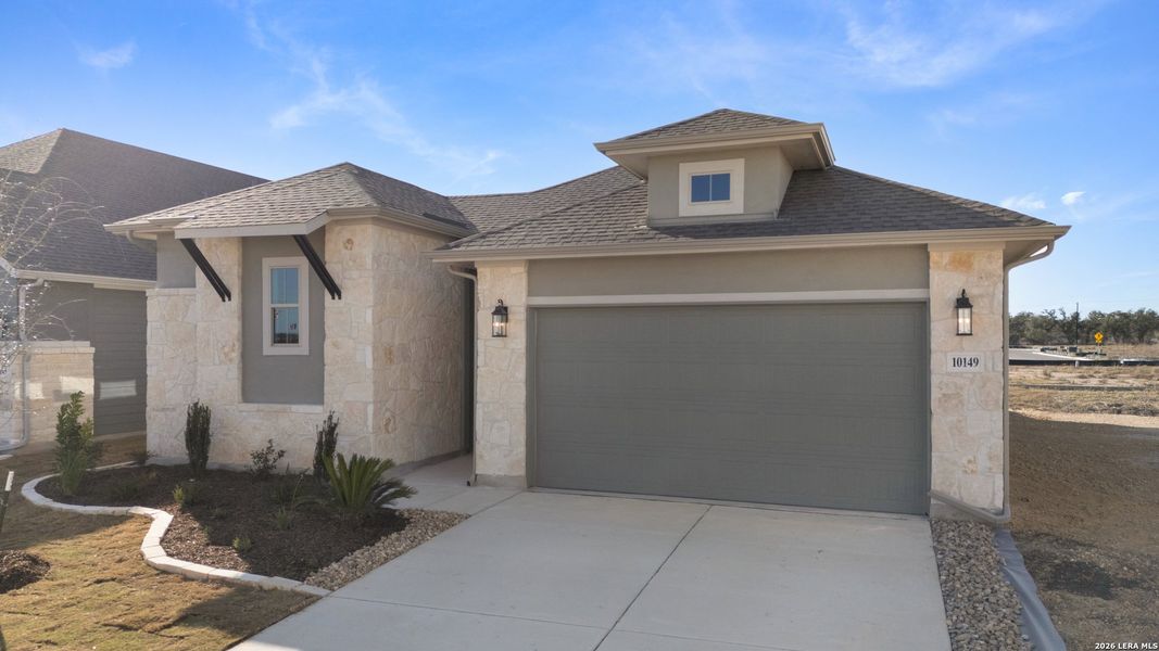 Front exterior of a new home in Davis Ranch, San Antonio, TX, highlighting curb appeal (Image 2).
