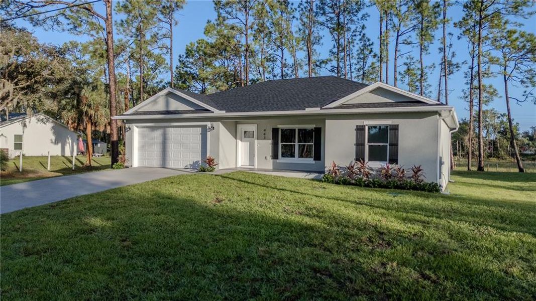 Front exterior of a new home in , Deltona, FL, highlighting curb appeal (Image 15).